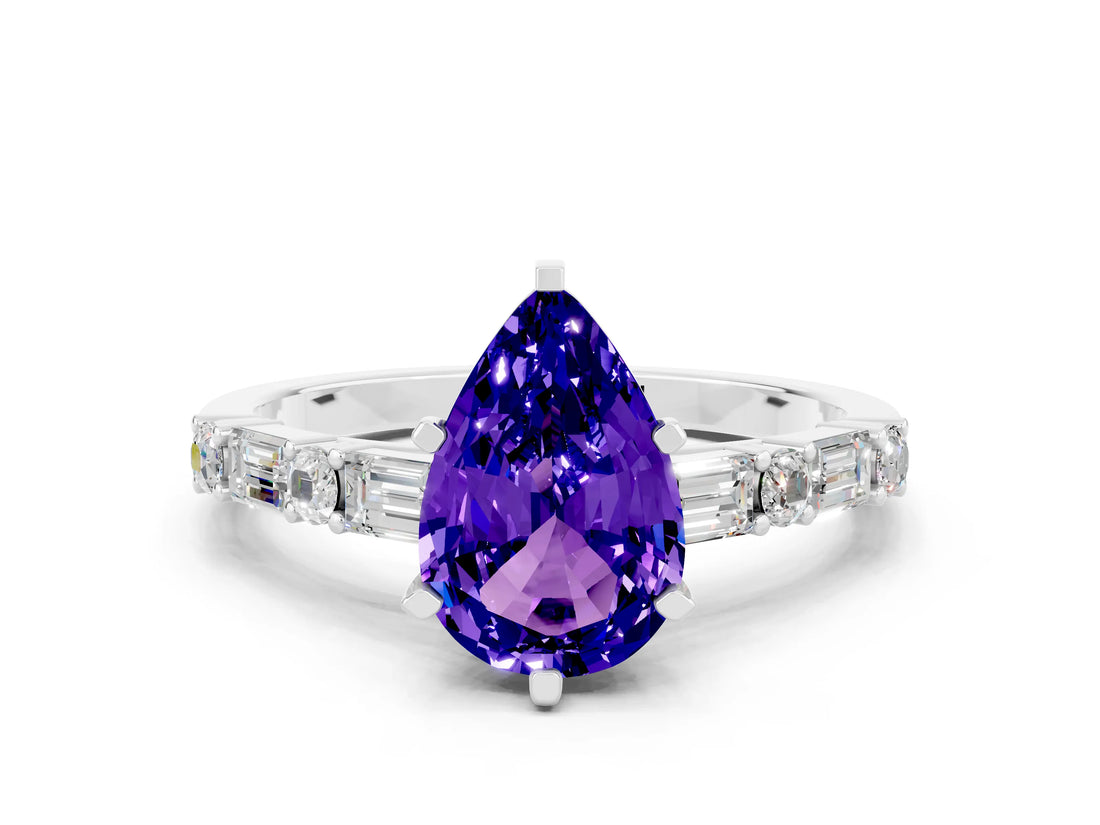 White gold Pear Cut Tanzanite Solitaire with Side Baguettes and Channel Set Band