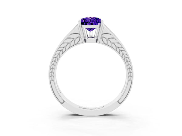 White gold Pear Cut Tanzanite Split Shank Ring with Pavé Band and Four-Prong Setting
