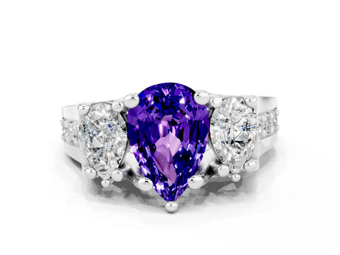 White gold Pear Cut Tanzanite Three-Stone Ring with Channel Set Band and Four-Prong Setting