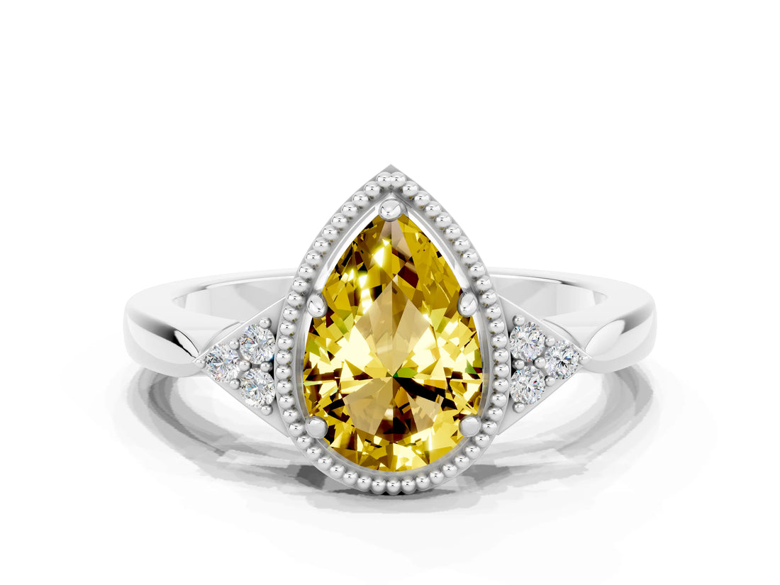 White gold Pear Cut Yellow Sapphire Halo Ring with Tapered Band and Four-Prong Setting