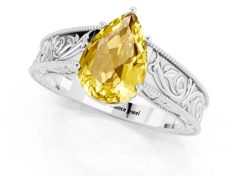 White gold Pear Cut Yellow Sapphire Solitaire Ring with Engraved Band and Four-Prong Setting_1