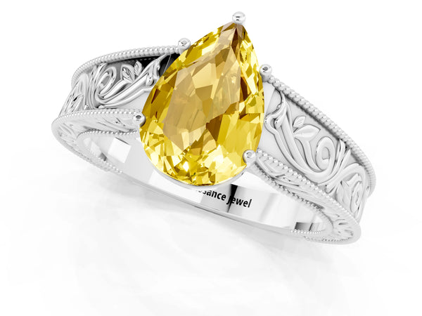 White gold Pear Cut Yellow Sapphire Solitaire Ring with Engraved Band and Four-Prong Setting