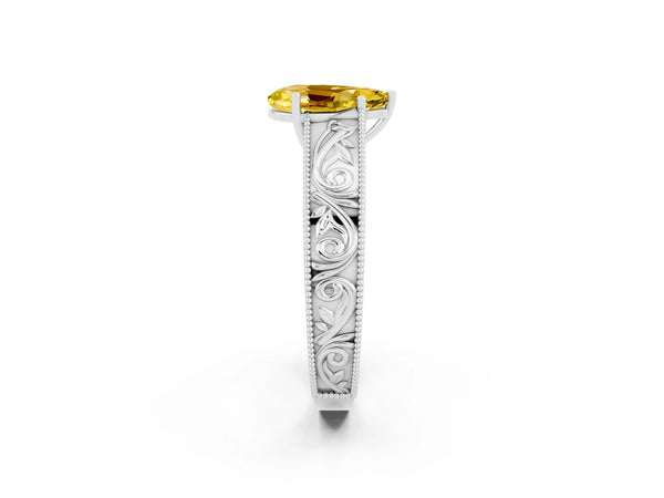 Platinum Pear Cut Yellow Sapphire Solitaire Ring with Engraved Band and Four-Prong Setting