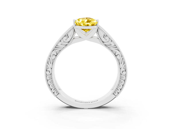 Platinum Pear Cut Yellow Sapphire Solitaire Ring with Engraved Band and Four-Prong Setting