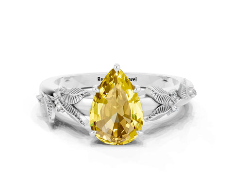 White gold Pear Cut Yellow Sapphire Solitaire Ring with Leaf Motif Band and Four-Prong Setting