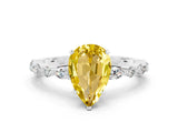 White gold Pear Cut Yellow Sapphire Solitaire with Side Stones on a Pavé Band and Four-Prong Setting_24