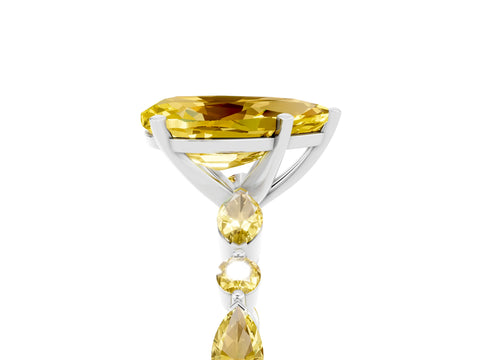 White gold Pear Cut Yellow Sapphire Solitaire with Side Stones on a Pavé Band and Four-Prong Setting_5
