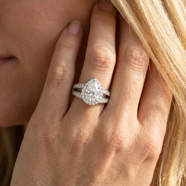 White gold Pear Diamond Halo Ring with Split Shank Pavé Band and Four-Prong Setting