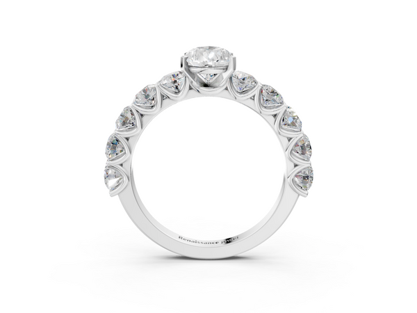 White gold Pear Cut Diamond Prong Setting with Side Stones on a Pave Band