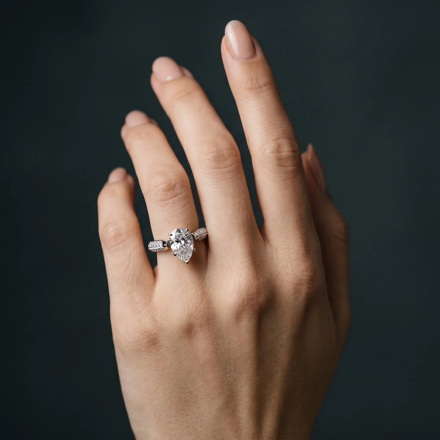 White gold Pear Diamond Solitaire Engagement Ring with Pavé Band and Four-Prong Setting