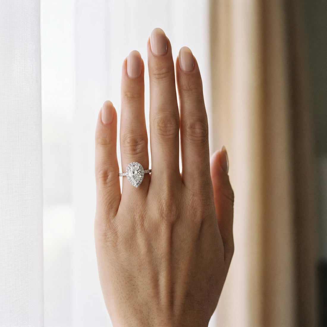 White gold Pear Halo Diamond Ring with Pavé Band and Three-Prong Setting_19