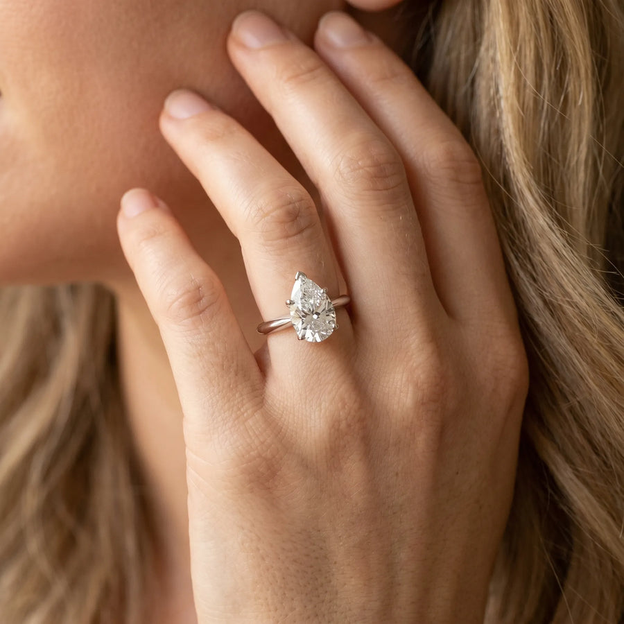 White gold Pear-Shaped Solitaire Diamond Ring with Tapered Band and Six-Prong Setting
