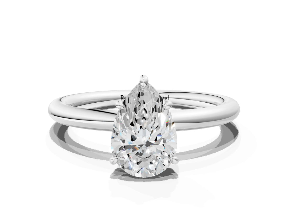 White gold Pear Solitaire Diamond Ring with Four-Prong Setting on a Plain Band_20