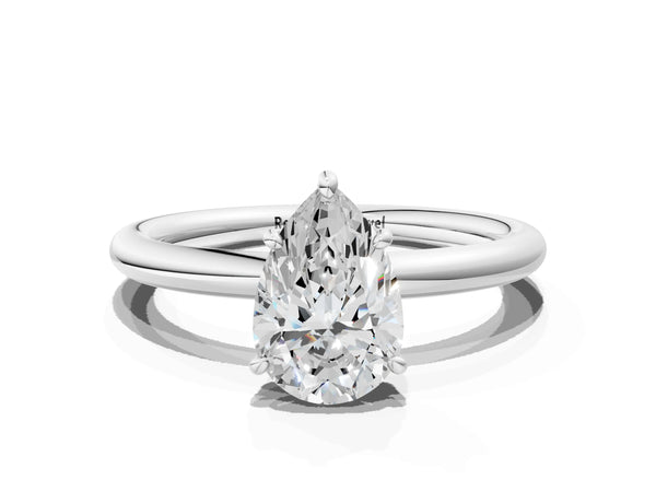 White gold Pear Solitaire Diamond Ring with Four-Prong Setting on a Plain Band