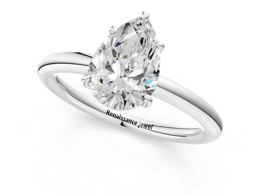 White gold Pear Solitaire Diamond Ring with Four-Prong Setting on a Plain Band
