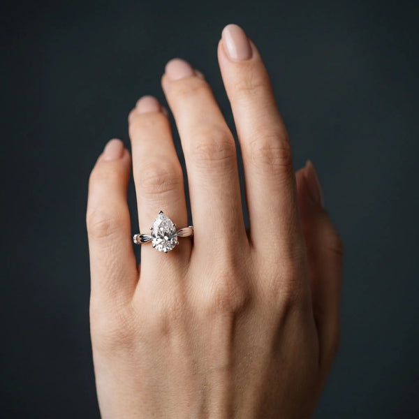 White gold Pear Solitaire Diamond Twisted Band with Four-Prong Setting