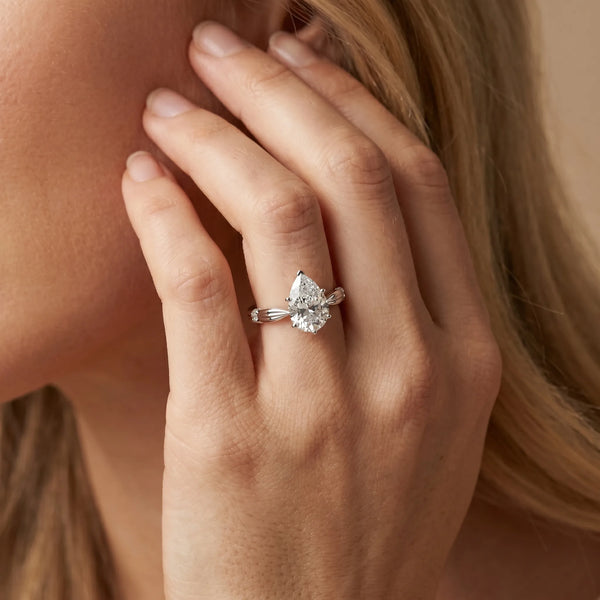 White gold Pear Solitaire Diamond Twisted Band with Four-Prong Setting