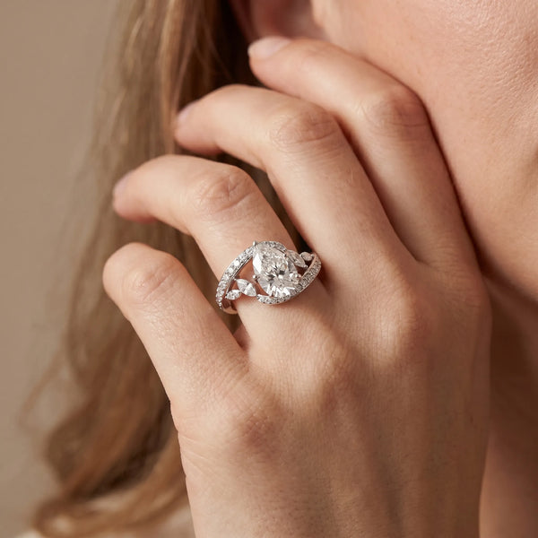 White gold Pear Solitaire with Pavé Twist Band and Four-Prong Setting