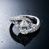 White gold Pear Solitaire with Pavé Twist Band and Four-Prong Setting_16