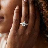 White gold Pear Solitaire with Tapered Baguette Side Stones on a Classic Band with Six-Prong Setting_189
