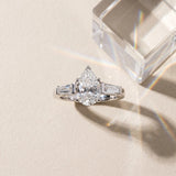 White gold Pear Solitaire with Tapered Baguette Side Stones on a Classic Band with Six-Prong Setting_192