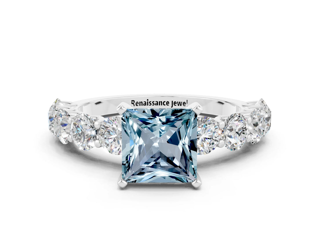 White gold Princess Cut Aquamarine Prong Setting with Side Stones on a Pave Band