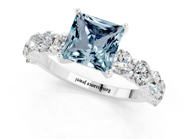 White gold Princess Cut Aquamarine Prong Setting with Side Stones on a Pave Band