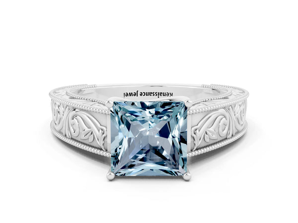 White gold Princess Cut Aquamarine Solitaire Ring with Engraved Band and Four-Prong Setting