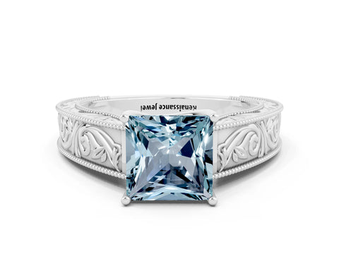 White gold Princess Cut Aquamarine Solitaire Ring with Engraved Band and Four-Prong Setting