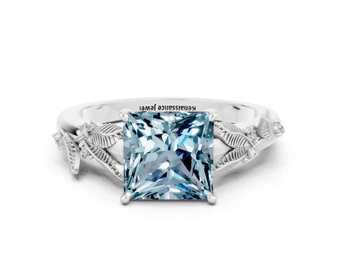 White gold Princess Cut Aquamarine Solitaire Ring with Leaf Motif Band and Four-Prong Setting
