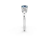Silver Aquamarine Three-Stone Ring with Four-Prong Setting and Classic Band