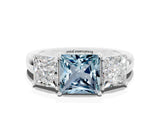 Silver Aquamarine Three-Stone Ring with Four-Prong Setting and Classic Band