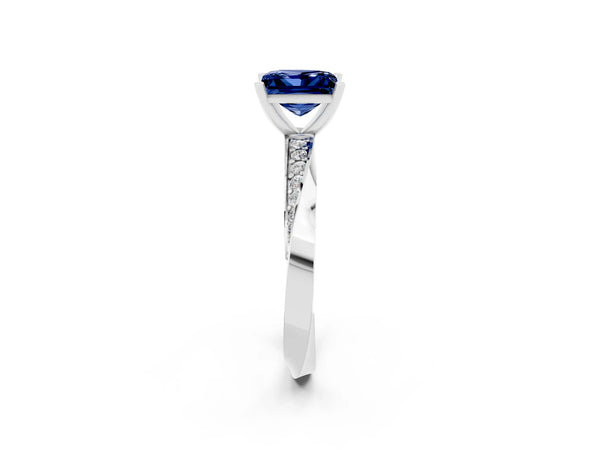 Silver Princess Cut Blue Sapphire Engagement Ring with Side Stone Accents and Four-Prong Setting