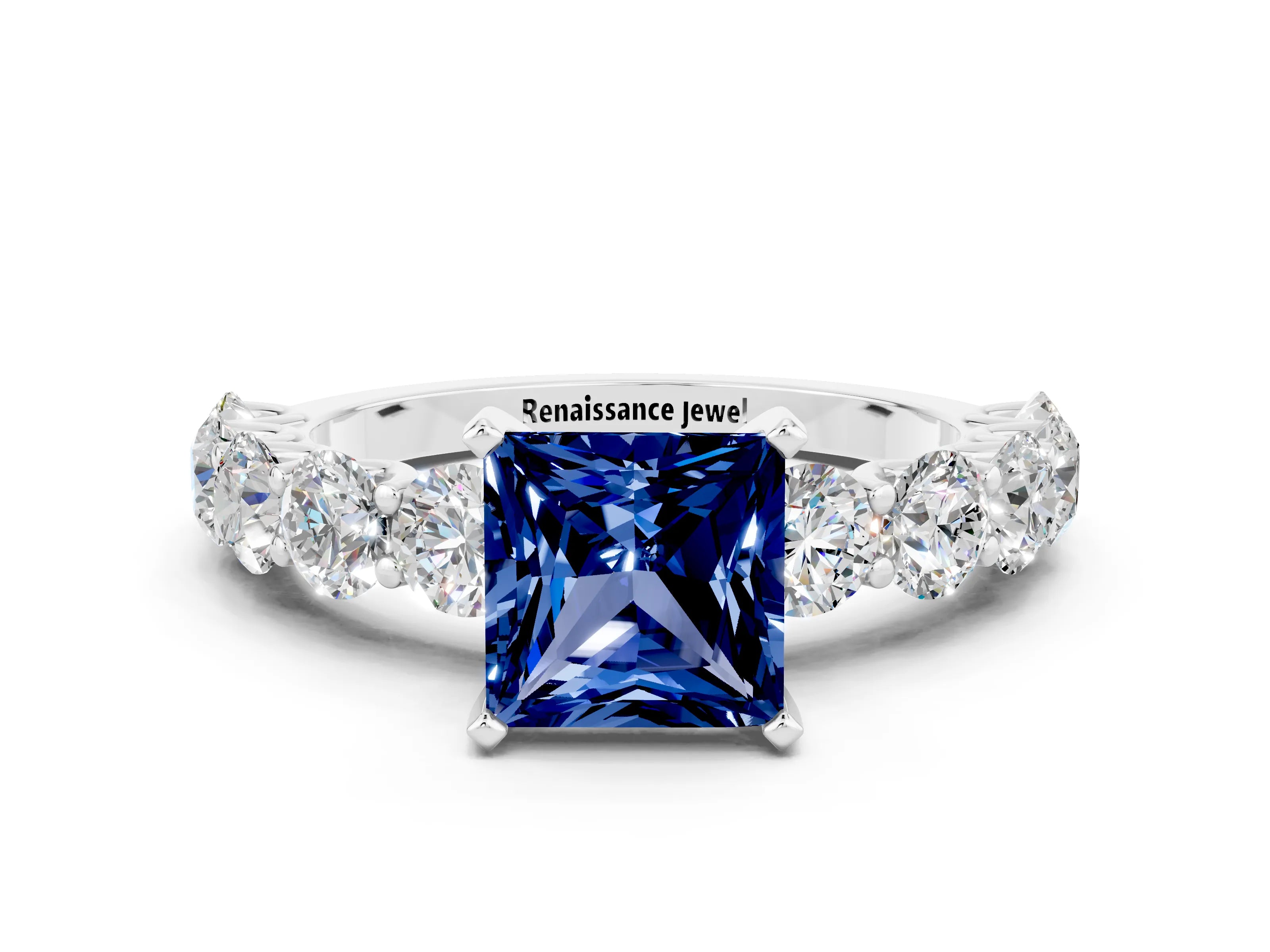 White gold Princess Cut Blue Sapphire Prong Setting with Side Stones on a Pave Band