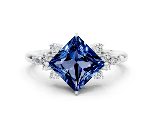 Platinum Princess Cut Blue Sapphire Ring with Side Stones and Four-Prong Setting