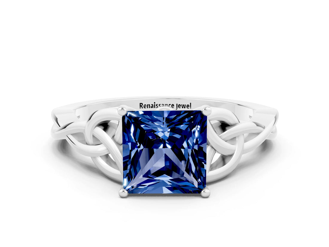 White gold Princess Cut Blue Sapphire Solitaire Engagement Ring with Celtic Knot Band and Four-Prong Setting