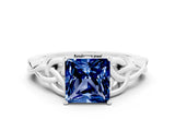 White gold Princess Cut Blue Sapphire Solitaire Engagement Ring with Celtic Knot Band and Four-Prong Setting