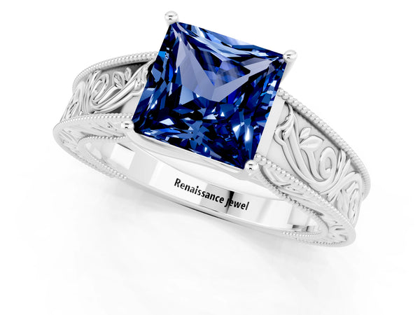 White gold Princess Cut Blue Sapphire Solitaire Ring with Engraved Band and Four-Prong Setting