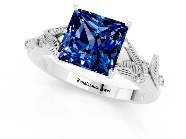 Silver Princess Cut Blue Sapphire Solitaire Ring with Leaf Motif Band and Four-Prong Setting