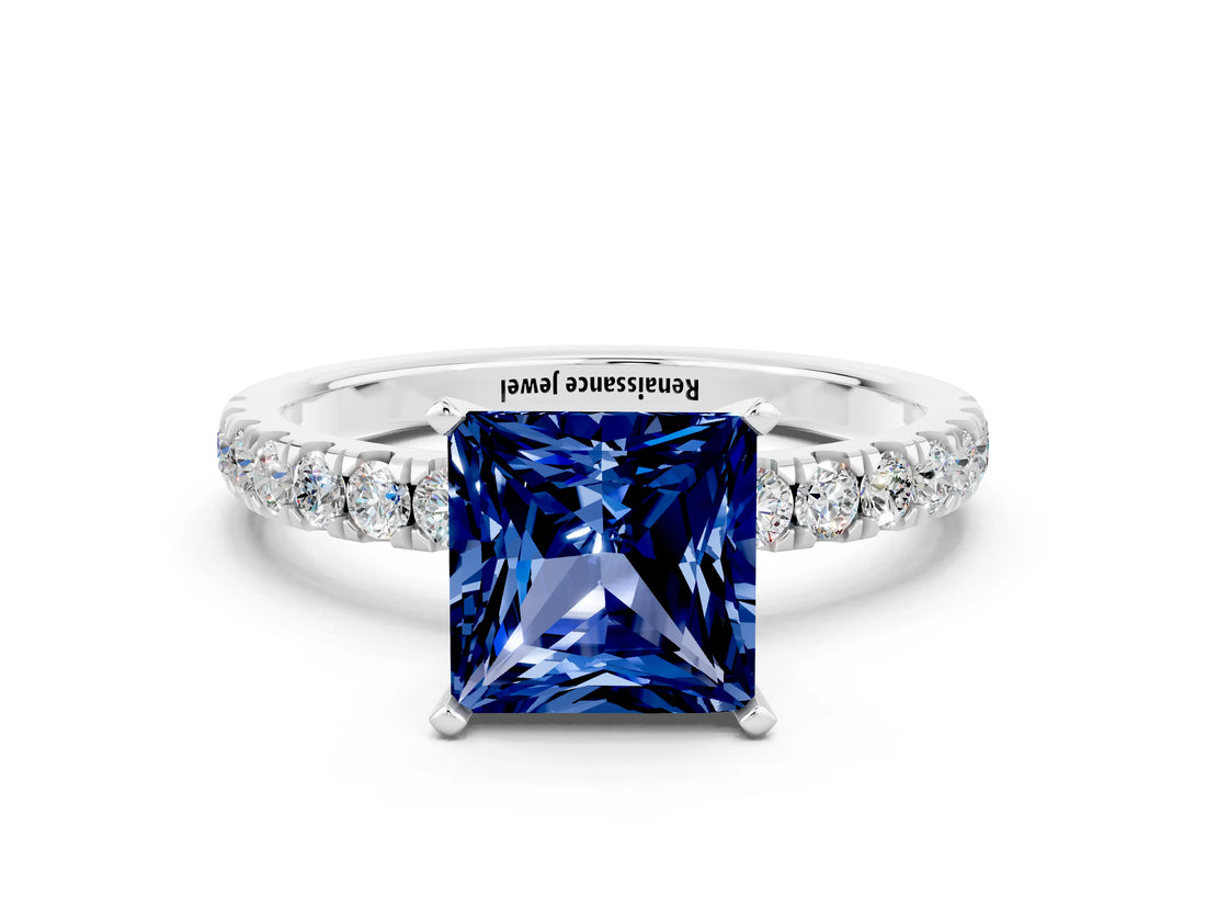 White gold Princess Cut Blue Sapphire Solitaire Ring with Pavé Accents and Four-Prong Setting