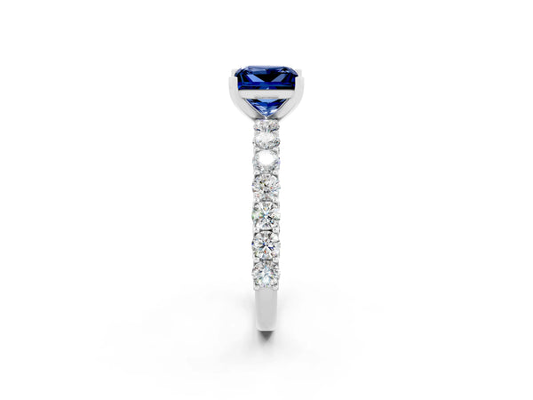 Silver Princess Cut Blue Sapphire Solitaire Ring with Shared Prong Pavé Band and Four-Prong Setting