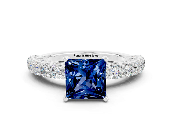 Silver Princess Cut Blue Sapphire Solitaire Ring with Shared Prong Pavé Band and Four-Prong Setting