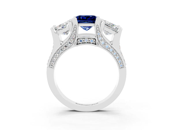 Platinum Princess Cut Blue Sapphire Three-Stone Ring with Channel Set Band and Four-Prong Setting