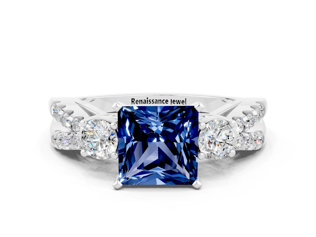 White gold Princess Cut Blue Sapphire Three-Stone Ring with Pavé Split Shank and Four-Prong Setting