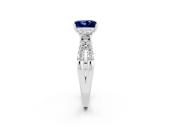 Platinum Princess Cut Blue Sapphire Three-Stone Ring with Pavé Split Shank and Four-Prong Setting