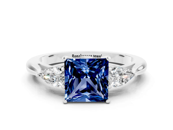 White gold Princess Cut Blue Sapphire Three-Stone Ring with Pear  Side Stones and Prong Setting
