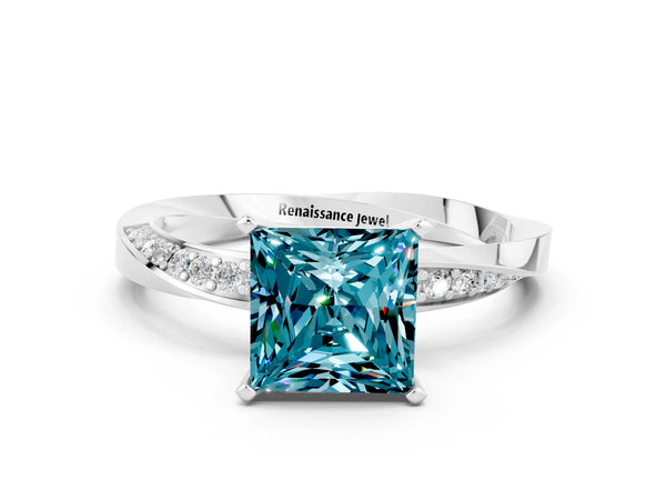 White gold Princess Cut Blue Topaz Engagement Ring with Side Stone Accents and Four-Prong Setting