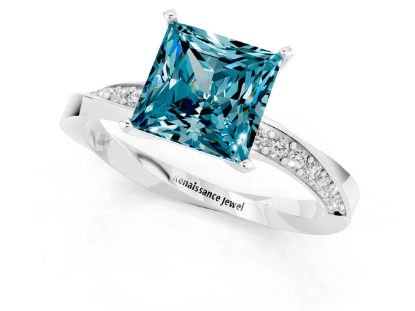 White gold Princess Cut Blue Topaz Engagement Ring with Side Stone Accents and Four-Prong Setting