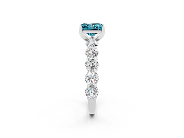 Platinum Princess Cut Blue Topaz Prong Setting with Side Stones on a Pave Band