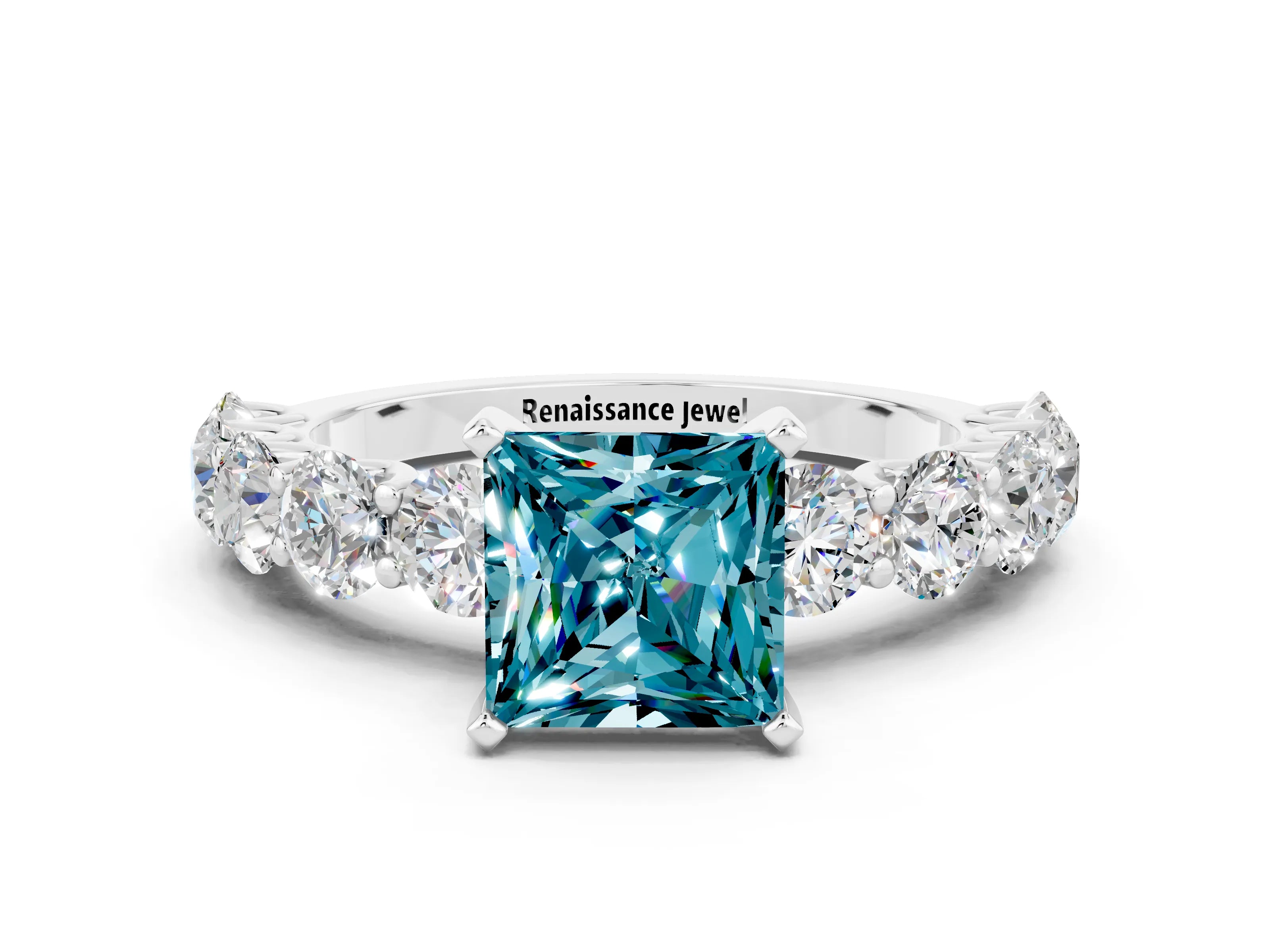 White gold Princess Cut Blue Topaz Prong Setting with Side Stones on a Pave Band